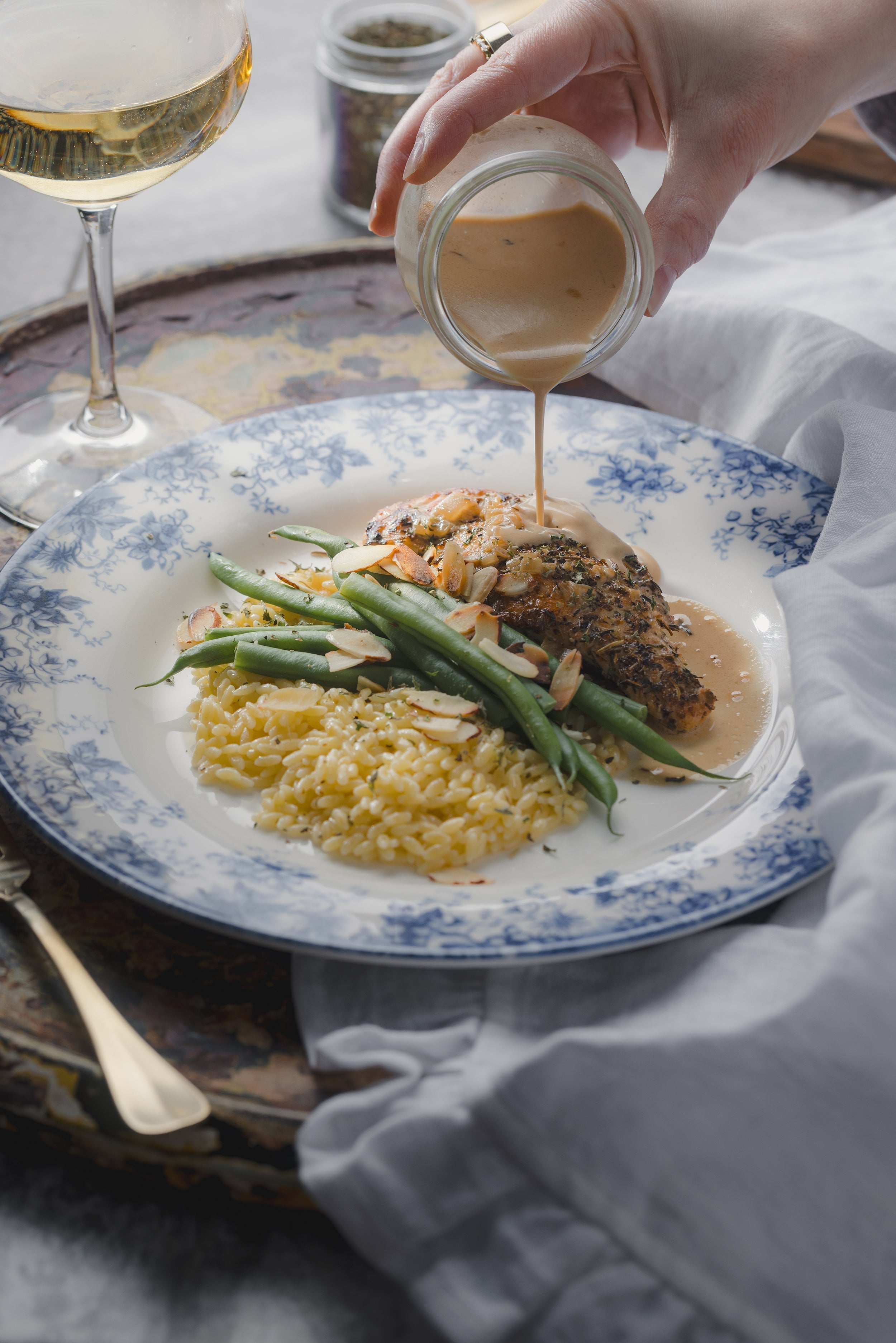 Pan-Seared Chicken with White Wine Sauce, Buttered Orzo, & Green Beans Almondine